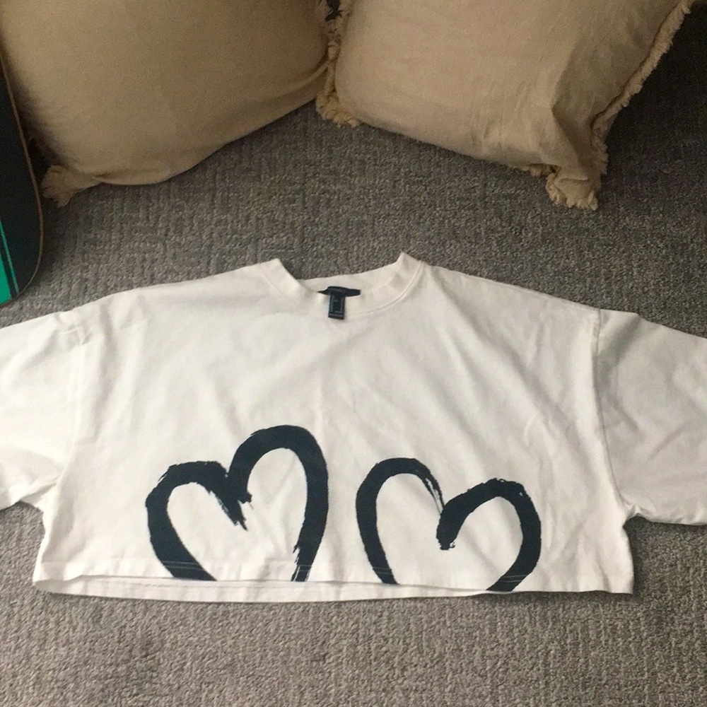 A white loose crop top with two black bear designs